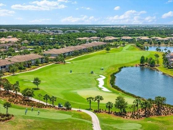 16804 Vardon Ter Unit 307, Bradenton, FL 34211 - aerial perspective of suburban area with a nearby body of water and a golf club