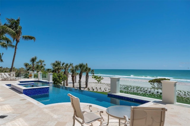 845 Longboat Club Rd, Longboat Key, FL 34228 - view of pool with view of water and beach, a patio, and a pool with connected hot tub