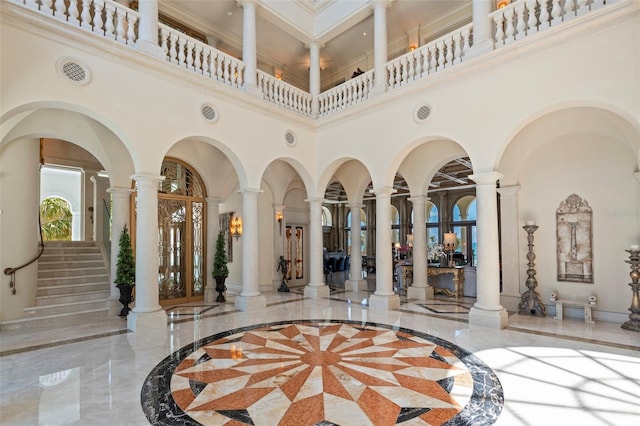 845 Longboat Club Rd, Longboat Key, FL 34228 - lobby with a high ceiling, crown molding, and stairway