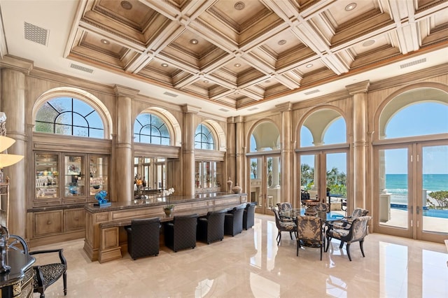 845 Longboat Club Rd, Longboat Key, FL 34228 - sunroom featuring french doors, coffered ceiling, a water view, and beamed ceiling