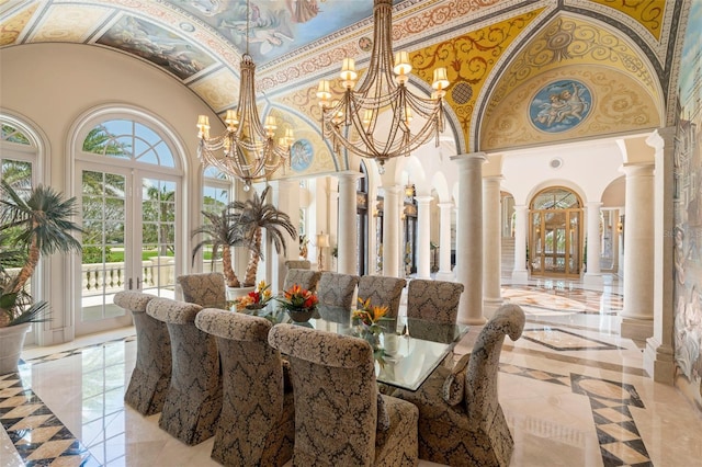 845 Longboat Club Rd, Longboat Key, FL 34228 - dining room with high vaulted ceiling, ornate columns, inlaid floor details, a chandelier, and light marble finish flooring