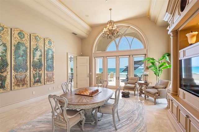 845 Longboat Club Rd, Longboat Key, FL 34228 - dining space featuring a chandelier, a towering ceiling, and light marble finish flooring