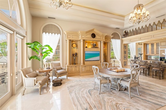 845 Longboat Club Rd, Longboat Key, FL 34228 - dining area with a chandelier, healthy amount of natural light, and arched walkways