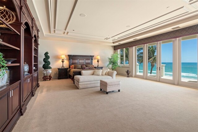 845 Longboat Club Rd, Longboat Key, FL 34228 - bedroom featuring access to exterior, light colored carpet, a water view, and baseboards