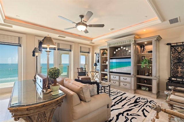 845 Longboat Club Rd, Longboat Key, FL 34228 - living area featuring a raised ceiling, healthy amount of natural light, ceiling fan, and a water view
