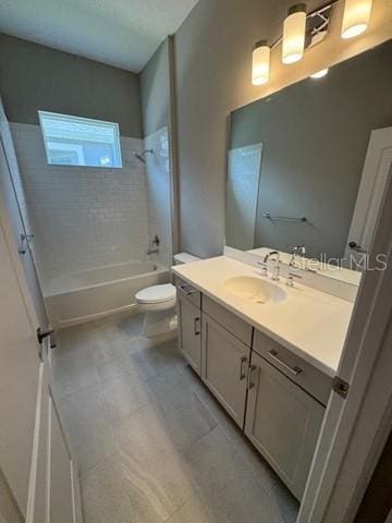 24827 Buckingham Way, Port Charlotte, FL 33980 - bathroom with toilet, vanity, and washtub / shower combination