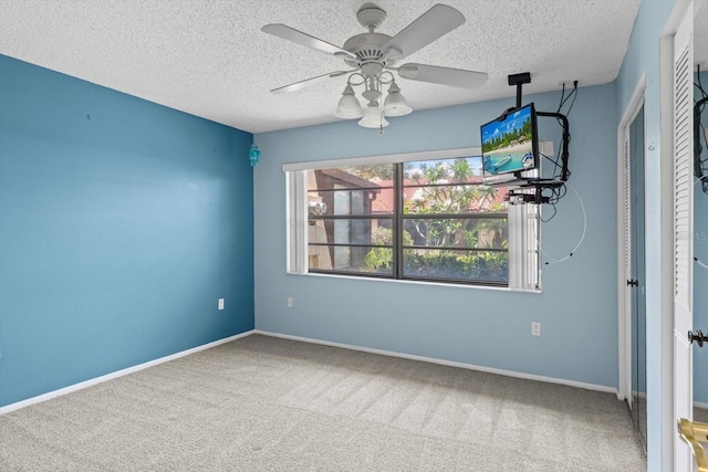 1227 56th St W Unit 1227, Bradenton, FL 34209 - spare room with carpet flooring, ceiling fan, and a textured ceiling
