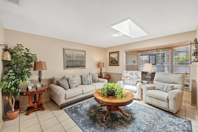 619 Albee Farm Rd N, Nokomis, FL 34275 - living area featuring a skylight and light tile patterned floors