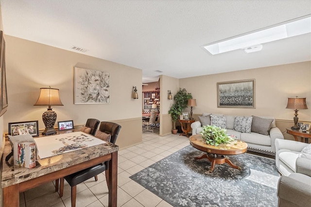 619 Albee Farm Rd N, Nokomis, FL 34275 - living area featuring a skylight and light tile patterned floors