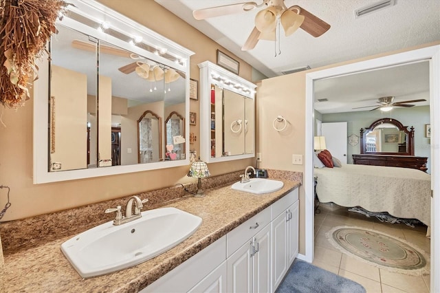 619 Albee Farm Rd N, Nokomis, FL 34275 - full bath with ensuite bathroom, a ceiling fan, double vanity, and tile patterned floors