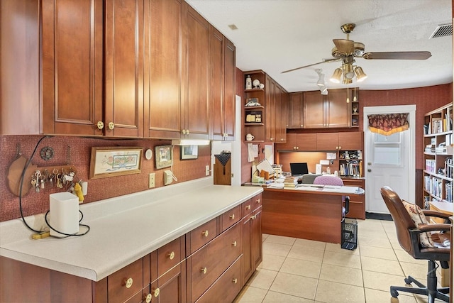 619 Albee Farm Rd N, Nokomis, FL 34275 - kitchen featuring open shelves, a ceiling fan, light tile patterned floors, a desk, and light countertops