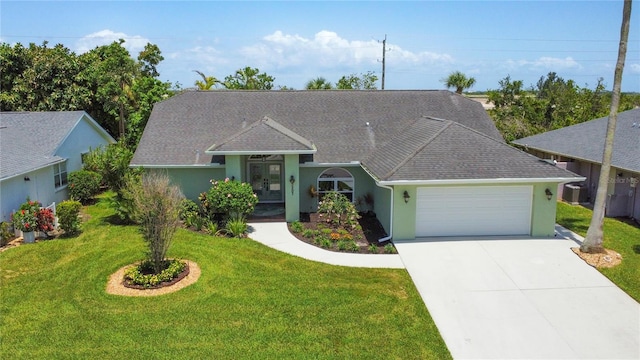 5207 86th Street Ct W, Bradenton, FL 34210 - view of front of property featuring an attached garage, a front yard, driveway, stucco siding, and roof with shingles