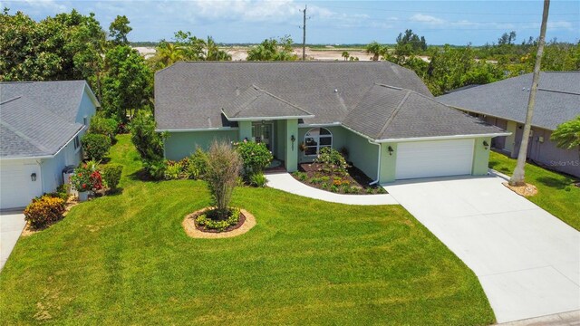 5207 86th Street Ct W, Bradenton, FL 34210 - single story home featuring a garage, concrete driveway, a front yard, and stucco siding