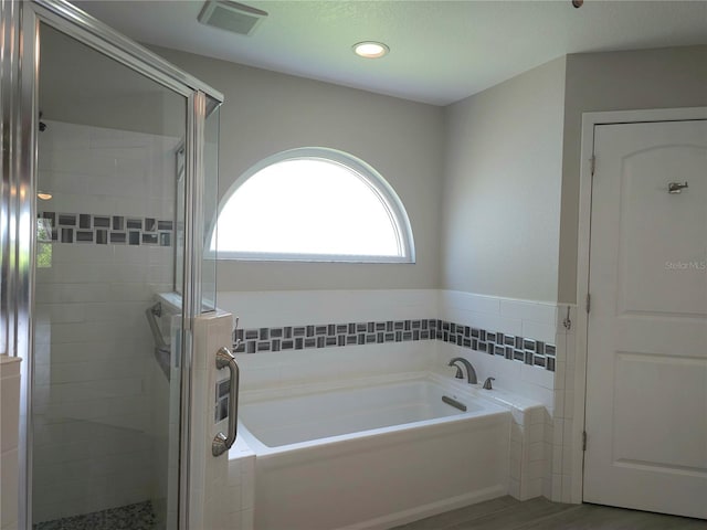 5207 86th Street Ct W, Bradenton, FL 34210 - full bath featuring a bath, a shower stall, and recessed lighting