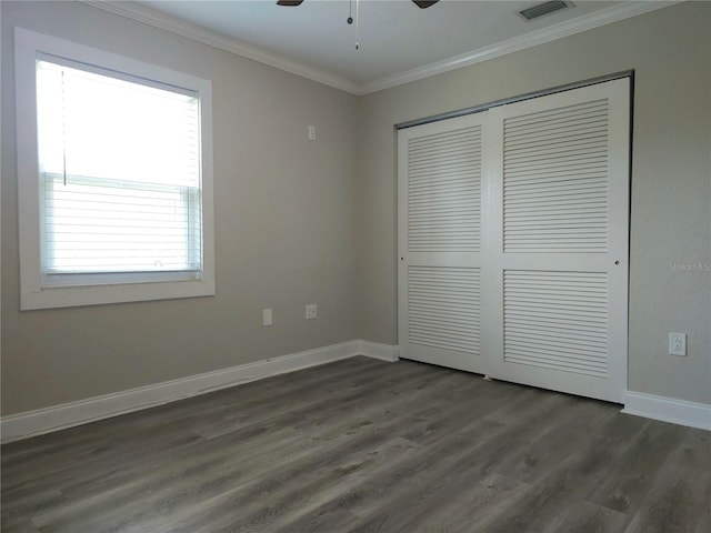 5207 86th Street Ct W, Bradenton, FL 34210 - unfurnished bedroom featuring dark wood finished floors, ornamental molding, a closet, baseboards, and ceiling fan