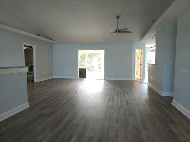 5207 86th Street Ct W, Bradenton, FL 34210 - unfurnished living room with ceiling fan, lofted ceiling, dark wood-style floors, and baseboards