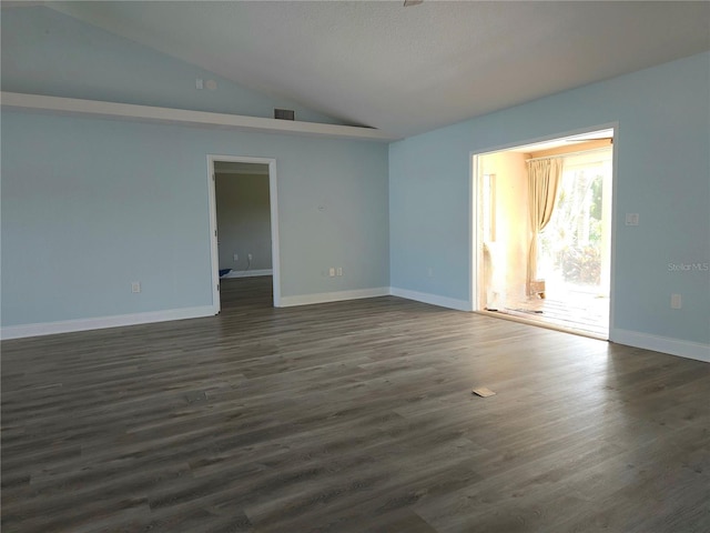 5207 86th Street Ct W, Bradenton, FL 34210 - unfurnished room featuring lofted ceiling, dark wood-style floors, and baseboards