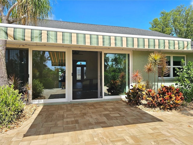 5207 86th Street Ct W, Bradenton, FL 34210 - view of exterior entry with roof with shingles