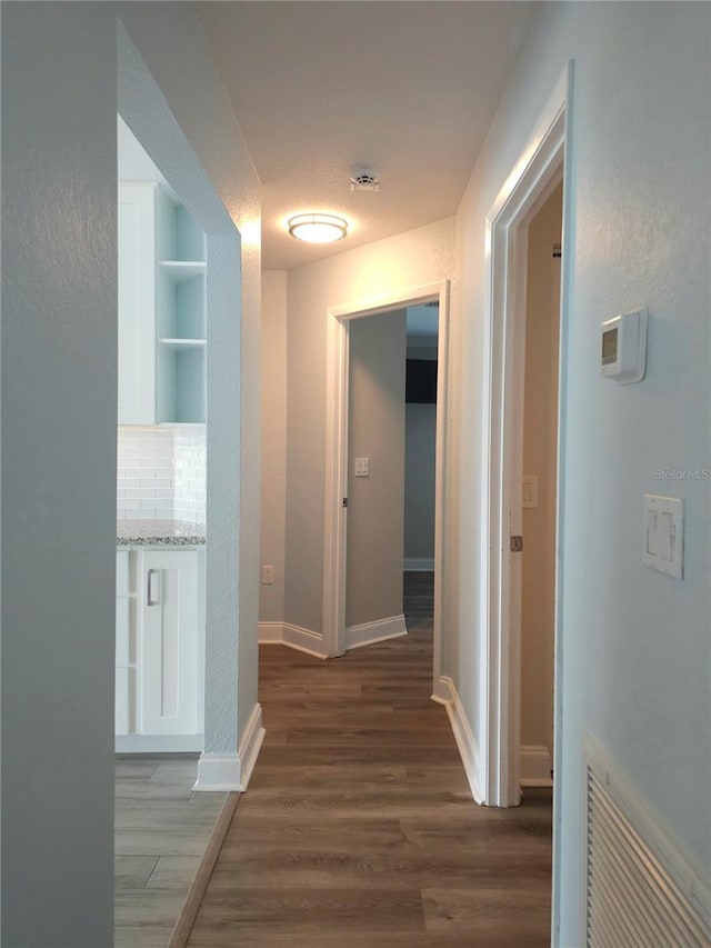 5207 86th Street Ct W, Bradenton, FL 34210 - hallway with wood finished floors and baseboards