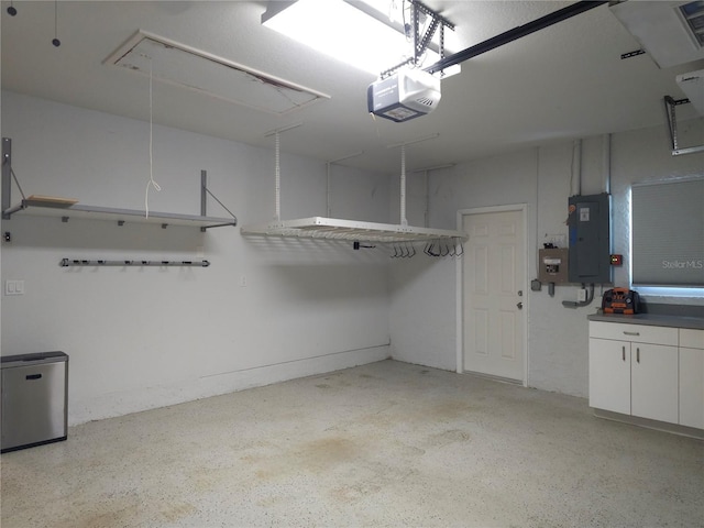 5207 86th Street Ct W, Bradenton, FL 34210 - garage featuring electric panel and a garage door opener