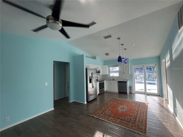 3339 Duar Ter, North Port, FL 34291 - living area featuring dark wood-type flooring, lofted ceiling, a ceiling fan, and baseboards