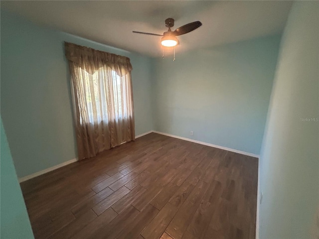 3339 Duar Ter, North Port, FL 34291 - unfurnished room with dark wood-type flooring, a ceiling fan, and baseboards