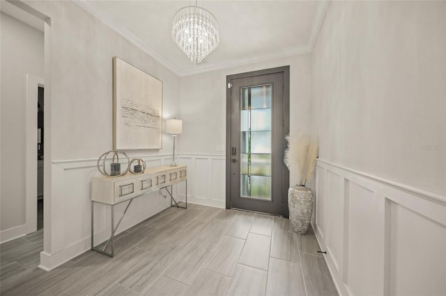 460 Daylily Blvd, Nokomis, FL 34275 - doorway to outside featuring a chandelier, a decorative wall, wainscoting, wood finish floors, and crown molding