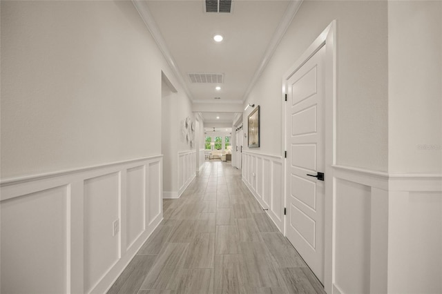 460 Daylily Blvd, Nokomis, FL 34275 - corridor featuring ornamental molding, recessed lighting, a decorative wall, and wainscoting