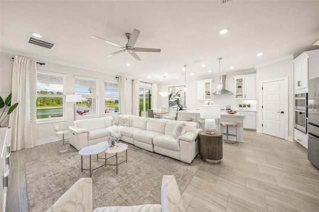 460 Daylily Blvd, Nokomis, FL 34275 - living room featuring ornamental molding, a ceiling fan, recessed lighting, and baseboards