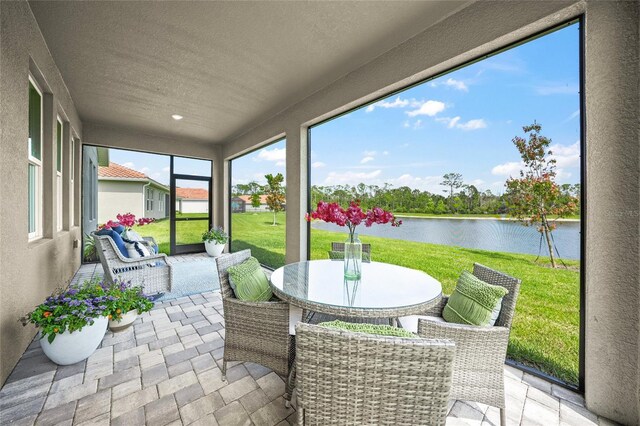 460 Daylily Blvd, Nokomis, FL 34275 - sunroom with a water view and outdoor dining area