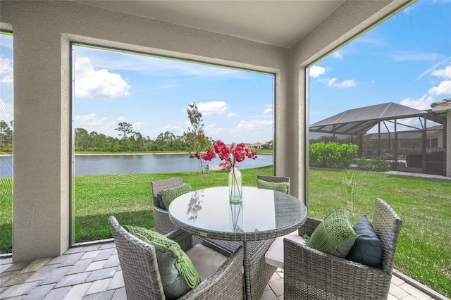 460 Daylily Blvd, Nokomis, FL 34275 - sunroom / solarium with a water view and outdoor dining area