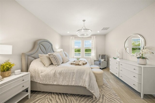 460 Daylily Blvd, Nokomis, FL 34275 - bedroom featuring multiple windows, a chandelier, light wood-type flooring, and recessed lighting
