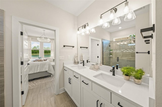 460 Daylily Blvd, Nokomis, FL 34275 - full bath with ensuite bathroom, double vanity, a stall shower, baseboards, and a chandelier