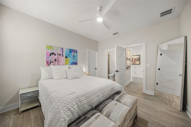 460 Daylily Blvd, Nokomis, FL 34275 - bedroom with baseboards, wood finished floors, ensuite bathroom, and ceiling fan