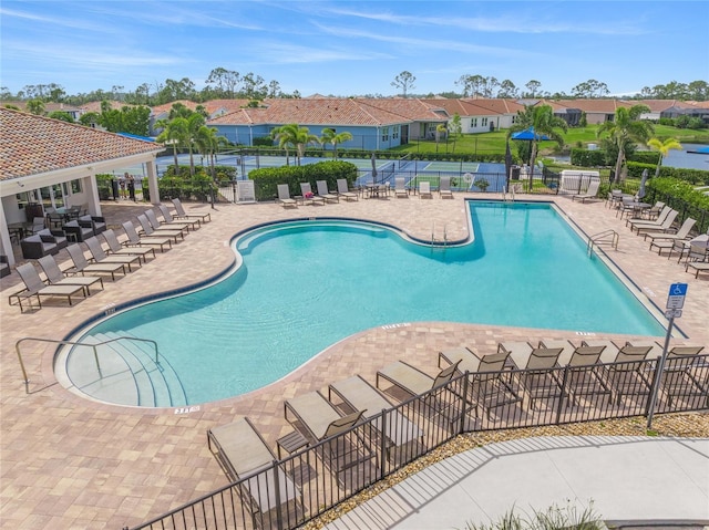 460 Daylily Blvd, Nokomis, FL 34275 - community pool featuring a patio area and a residential view