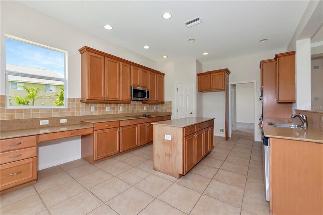 4307 70th Ave E, Ellenton, FL 34222 - kitchen featuring stainless steel microwave, black electric cooktop, backsplash, a sink, and recessed lighting