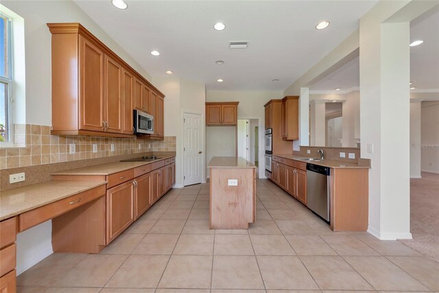 4307 70th Ave E, Ellenton, FL 34222 - kitchen with stainless steel appliances, decorative backsplash, light countertops, light tile patterned flooring, and recessed lighting
