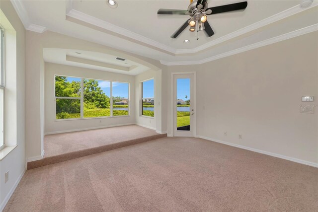 4307 70th Ave E, Ellenton, FL 34222 - carpeted spare room with a raised ceiling, crown molding, a ceiling fan, baseboards, and a water view