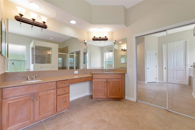 4307 70th Ave E, Ellenton, FL 34222 - bathroom with double vanity, tile patterned floors, plenty of natural light, a shower with shower door, and recessed lighting