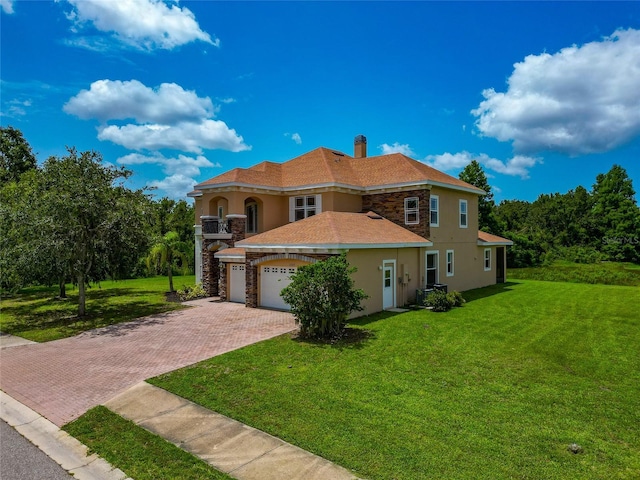 4307 70th Ave E, Ellenton, FL 34222 - mediterranean / spanish-style home featuring stucco siding, stone siding, decorative driveway, and a front yard