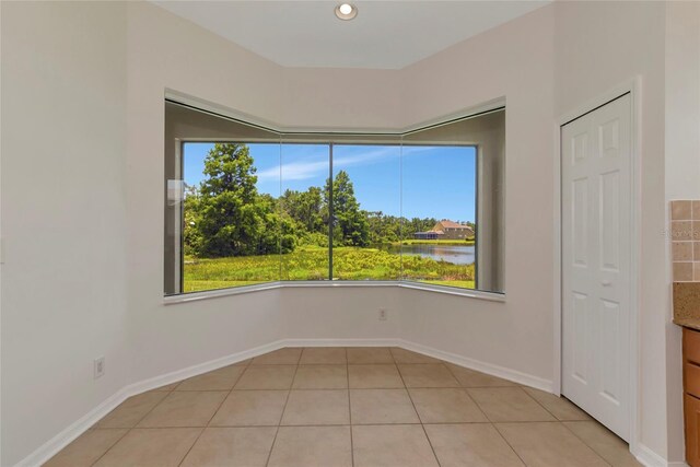 4307 70th Ave E, Ellenton, FL 34222 - empty room featuring healthy amount of natural light, light tile patterned floors, a water view, baseboards, and recessed lighting
