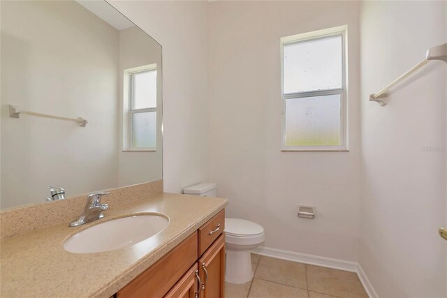 4307 70th Ave E, Ellenton, FL 34222 - bathroom featuring toilet, vanity, tile patterned floors, and baseboards