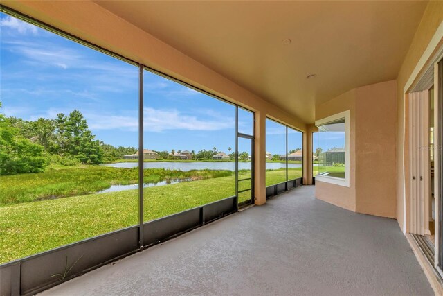 4307 70th Ave E, Ellenton, FL 34222 - unfurnished sunroom featuring a water view and vaulted ceiling