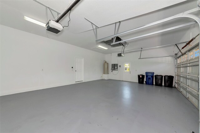 4307 70th Ave E, Ellenton, FL 34222 - garage with a garage door opener, electric panel, and gas water heater