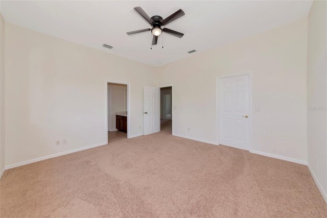 4307 70th Ave E, Ellenton, FL 34222 - unfurnished bedroom with light carpet, baseboards, and a ceiling fan