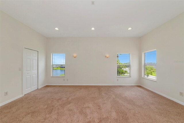 4307 70th Ave E, Ellenton, FL 34222 - unfurnished room with plenty of natural light, light carpet, recessed lighting, and baseboards