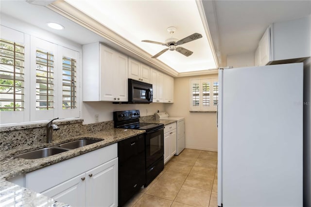 9412 Concord Cir, Bradenton, FL 34210 - kitchen featuring black appliances, a sink, white cabinetry, a ceiling fan, and light stone countertops