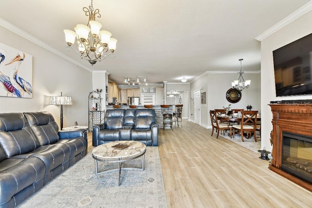 2825 Terra Ceia Bay Blvd Unit 1804, Palmetto, FL 34221 - living room featuring a chandelier, light wood-style flooring, and ornamental molding