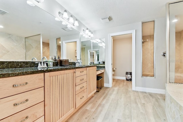 2825 Terra Ceia Bay Blvd Unit 1804, Palmetto, FL 34221 - bathroom with double vanity, wood finished floors, and walk in shower