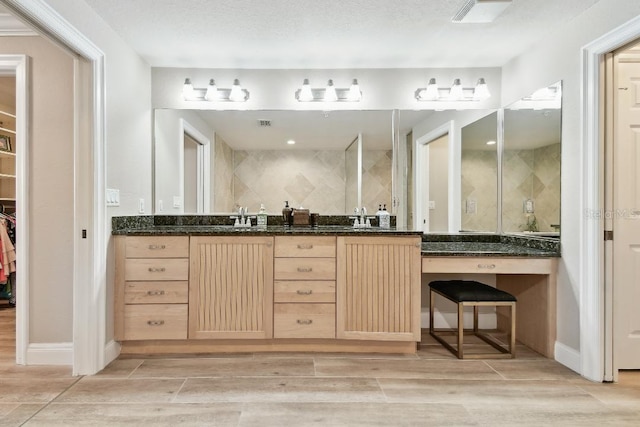 2825 Terra Ceia Bay Blvd Unit 1804, Palmetto, FL 34221 - bathroom with wood tiled floors, double vanity, a walk in closet, and tiled shower